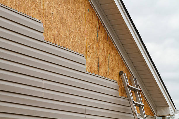 Professional Emergency Siding Repair technician working in Willow Street, PA